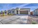 Well-maintained single-Gathering home with a wide driveway and attractive landscaping, enhancing its curb appeal at 5267 E Diatomite Dr, San Tan Valley, AZ 85143