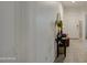 Hallway featuring decoratively adorned table, mirror, and a clear view of entryway at 5267 E Diatomite Dr, San Tan Valley, AZ 85143