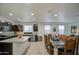 Open floor plan with kitchen island and dining area at 5267 E Diatomite Dr, San Tan Valley, AZ 85143