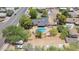 Enjoy a private backyard oasis with swimming pool, fire pit, and lush greenery at 6330 E Delcoa Ave, Scottsdale, AZ 85254