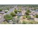 Neighborhood aerial view of a landscaped home, featuring a refreshing pool and a spacious backyard at 6330 E Delcoa Ave, Scottsdale, AZ 85254