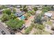 Expansive property featuring a large pool, lush greenery, and ample parking for vehicles and RVs at 6330 E Delcoa Ave, Scottsdale, AZ 85254