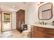 Bathroom featuring a toilet, wooden vanity, and decor accents at 6330 E Delcoa Ave, Scottsdale, AZ 85254