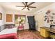 Cozy bedroom featuring an exposed ceiling fan, a desk, and a small bed at 6330 E Delcoa Ave, Scottsdale, AZ 85254
