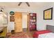 Bedroom featuring a desk, a small bed, and an exposed ceiling fan at 6330 E Delcoa Ave, Scottsdale, AZ 85254