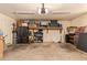 Spacious garage with storage, lighting, and organization solutions, offering ample space for vehicles and projects at 6330 E Delcoa Ave, Scottsdale, AZ 85254