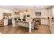 Stylish kitchen featuring stainless steel appliances, custom cabinets, and a window overlooking the yard at 6330 E Delcoa Ave, Scottsdale, AZ 85254