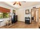 Versatile office space featuring a cozy corner with a window, cat tree and classic storage, creating a comfortable atmosphere at 6330 E Delcoa Ave, Scottsdale, AZ 85254