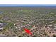 Scenic aerial view of a desert neighborhood with tile roof homes, community golf, and pool at 6714 E Nightingale Cir, Scottsdale, AZ 85266