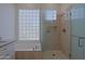 A luxurious bathroom showcases a soaking tub and a tiled shower with frameless glass enclosure at 6714 E Nightingale Cir, Scottsdale, AZ 85266