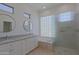 Bathroom with dual sinks, marble counters, and step-in shower at 6714 E Nightingale Cir, Scottsdale, AZ 85266