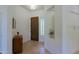 Foyer with hardwood front door, tile floors, and built-in shelving at 6714 E Nightingale Cir, Scottsdale, AZ 85266