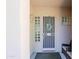 Front porch with security door, wreath, and glass block windows at 6714 E Nightingale Cir, Scottsdale, AZ 85266
