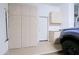 Spacious garage includes storage cabinets and access door to the interior of the home at 6714 E Nightingale Cir, Scottsdale, AZ 85266