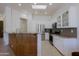 Modern kitchen featuring white cabinets, stainless steel appliances, granite countertops, and a breakfast bar at 6714 E Nightingale Cir, Scottsdale, AZ 85266