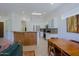 Open kitchen features a skylight and breakfast bar with wooden facade at 6714 E Nightingale Cir, Scottsdale, AZ 85266