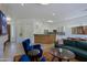 Bright living room with open floor plan showcasing a modern kitchen, comfortable seating, and stylish decor at 6714 E Nightingale Cir, Scottsdale, AZ 85266