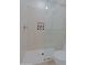 Close up of the tiled walk-in shower with glass enclosure and recessed shelf at 6714 E Nightingale Cir, Scottsdale, AZ 85266