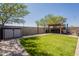 Spacious backyard with green grass, pergola and outdoor seating at 7238 N 126Th Ln, Glendale, AZ 85307