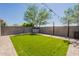 This backyard features turf, a storage shed, and brick pavers perfect for relaxing and entertaining at 7238 N 126Th Ln, Glendale, AZ 85307