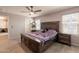 Well-lit bedroom with natural light and furniture in the corner at 7238 N 126Th Ln, Glendale, AZ 85307