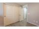 Spacious bedroom closet with sliding doors and additional shelving at 7238 N 126Th Ln, Glendale, AZ 85307