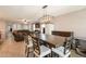 Dining room featuring chandelier lighting, dining table and comfortable seating at 7238 N 126Th Ln, Glendale, AZ 85307