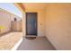 Welcoming front porch features a gray front door and covered entryway at 7238 N 126Th Ln, Glendale, AZ 85307