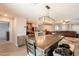 Open concept kitchen with stainless steel appliances, dining area, and living room at 7238 N 126Th Ln, Glendale, AZ 85307