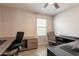 Office space featuring built-in desk and an ergonomic office chair at 7238 N 126Th Ln, Glendale, AZ 85307