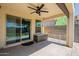 Covered patio features hot tub, ample seating, and tile flooring at 7238 N 126Th Ln, Glendale, AZ 85307