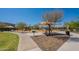 Inviting playground with shade covers and benches surrounded by lush landscaping at 7238 N 126Th Ln, Glendale, AZ 85307