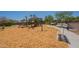 Community playground with swings, slides, and bench seating for a day of play at 7238 N 126Th Ln, Glendale, AZ 85307