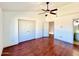 Spacious bedroom with hardwood floors, ceiling fan, and closet at 7801 N 44Th Dr # 1180, Glendale, AZ 85301