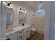 Modern bathroom featuring double sinks, white cabinets, and a shower-tub combination with white subway tile at 81 E Smoke Tree Rd, Gilbert, AZ 85296