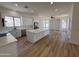 A bright, open kitchen featuring a large island, white cabinets, and stainless steel appliances at 81 E Smoke Tree Rd, Gilbert, AZ 85296