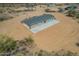 Back of home highlighting expansive back patio and desert surroundings at 873 N Windy Meadow Ln, Maricopa, AZ 85139