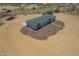 Back of home with a spacious concrete patio and desert landscape at 873 N Windy Meadow Ln, Maricopa, AZ 85139