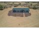 Stunning aerial view of a home featuring desert landscaping and a charming facade at 873 N Windy Meadow Ln, Maricopa, AZ 85139