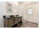 Bathroom vanity area, complete with framed fish wall art, a toilet and tub at 873 N Windy Meadow Ln, Maricopa, AZ 85139