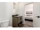Bathroom and bedroom featuring modern fixtures and serene bedroom views at 873 N Windy Meadow Ln, Maricopa, AZ 85139