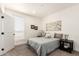 Bright bedroom with white trim and ample natural light at 873 N Windy Meadow Ln, Maricopa, AZ 85139