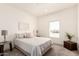 Cozy bedroom with neutral decor, carpet and a window offering natural light at 873 N Windy Meadow Ln, Maricopa, AZ 85139