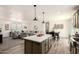 Open-concept kitchen with large island, perfect for entertaining and adjacent to the living area at 873 N Windy Meadow Ln, Maricopa, AZ 85139