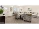 Bright living room featuring an open floor plan, modern furnishings and lots of natural light at 873 N Windy Meadow Ln, Maricopa, AZ 85139