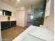 Bright bathroom with a glass walk-in shower, grey vanity, and stylish countertops at 9053 N 53Rd Ave, Glendale, AZ 85302