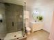 Modern bathroom featuring a glass walk-in shower, new vanity, and new lighting for a refreshed look at 9053 N 53Rd Ave, Glendale, AZ 85302