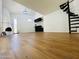 Spacious living area with hardwood floors and a unique spiral staircase at 9053 N 53Rd Ave, Glendale, AZ 85302