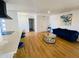 Bright, open-concept living area with hardwood floors and designer finishes at 9053 N 53Rd Ave, Glendale, AZ 85302