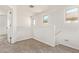 Upstairs hallway has carpeted floor, natural light and open space, for easy access to rooms at 909 E Agua Fria Ln, Avondale, AZ 85323